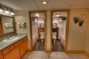 two adjoining bathrooms in hotel suite in Pigeon Forge Tn